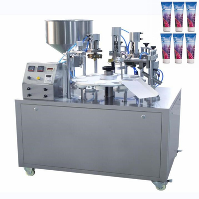 Máquina de llenado y sellado de aceite rotativo crema cosmética tubo blando Máquina de embalaje de sellado térmico